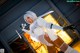 A woman in a white lingerie holding a sword.